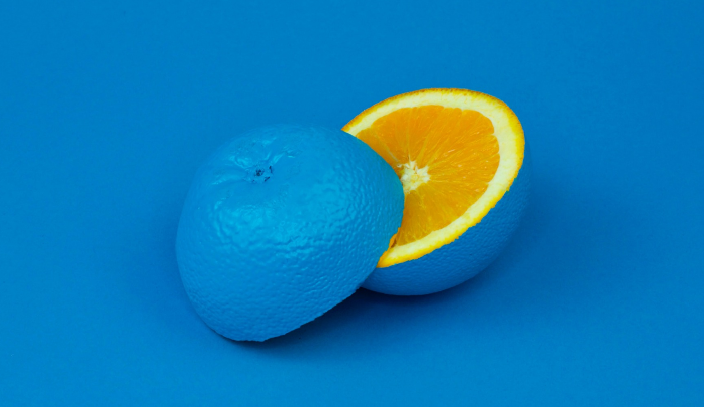 an orange painted blue on the outside but orange inside