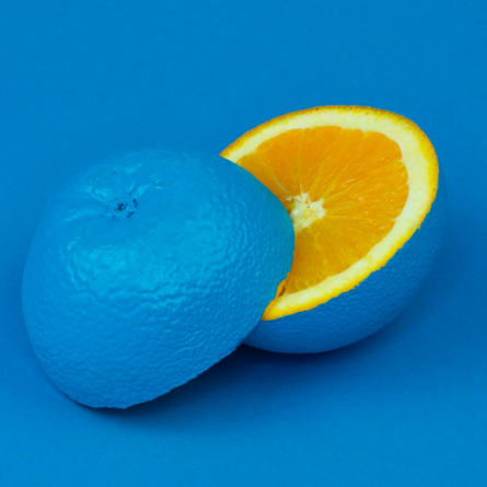 an orange painted blue on the outside but orange inside