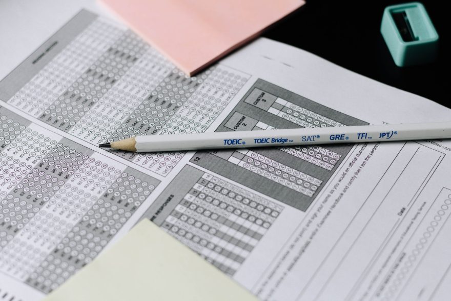 a multiple choice test bubble sheet with a pencil on top of it