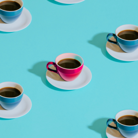 Rendered image of a grid composed of turquoise-colored tea cups, with a distinct rose-colored tea cup positioned at the center, creating a focal point within the composition.