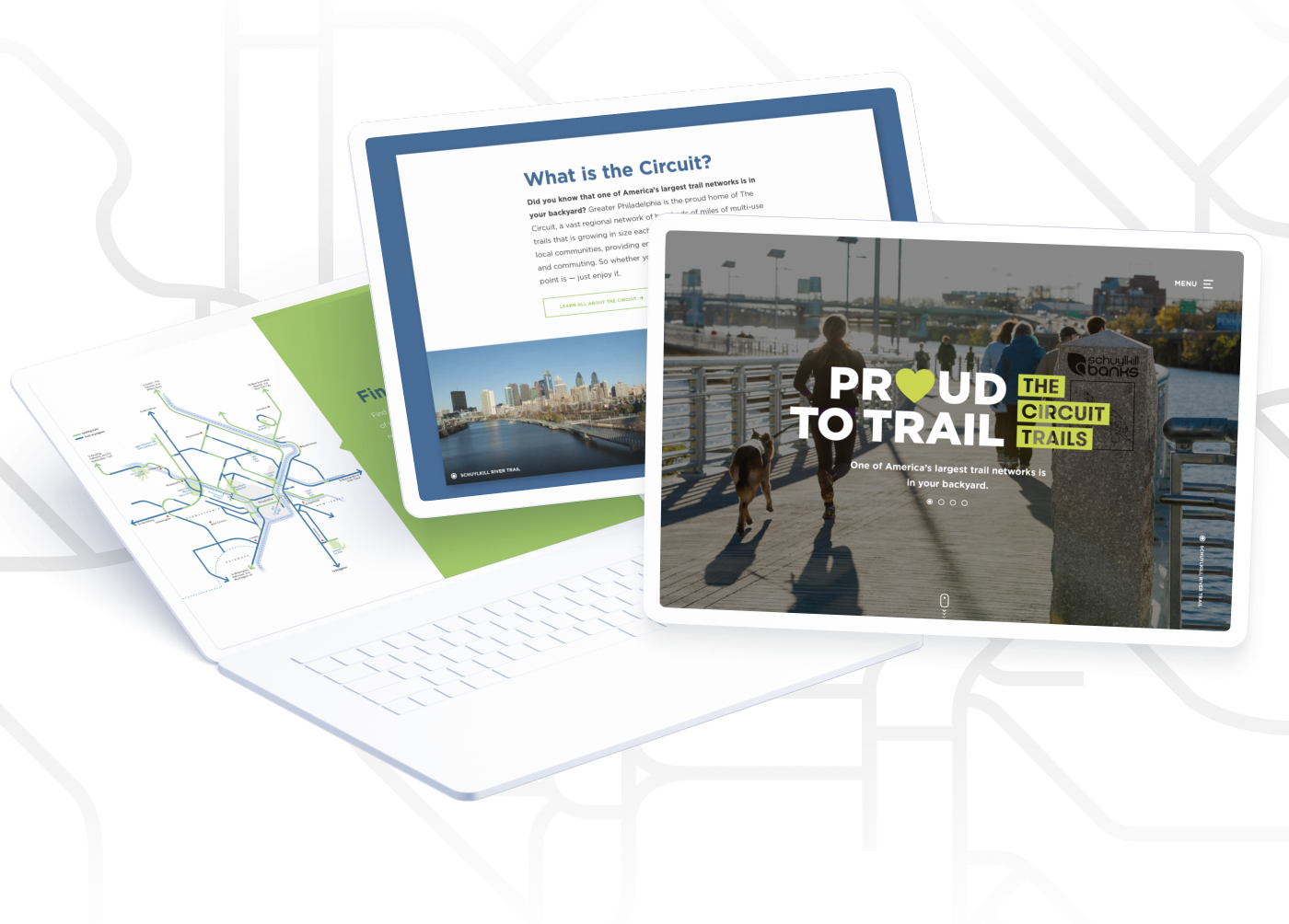 Circuit Trails Mockups showing different web pages on a laptop and two tablets, featuring map trails and images.