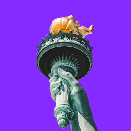 Statue of Liberty torch against a purple background.