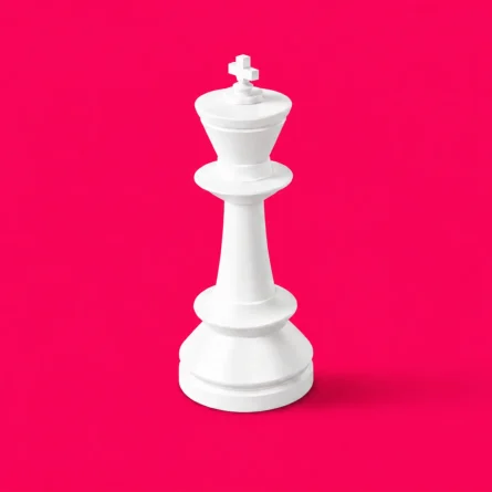 White chess king on a bright pink background representing digital strategy.