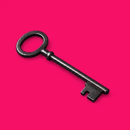 Charcoal metal skeleton key lying diagonally on a bright pink background.