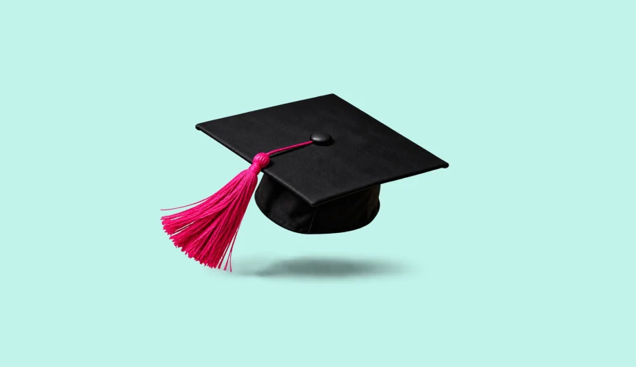 Black graduation cap with a pink tassel floating above a pale mint background.