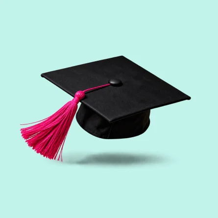 Black graduation cap with a pink tassel floating above a pale mint background.