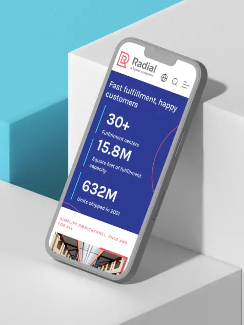 the Radial mobile site with stats on a mobile screen leaning against a box