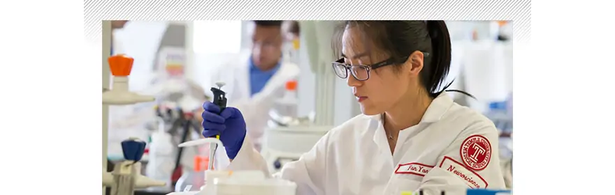 an image on the Temple University viewbook website of a young woman working in a science lab