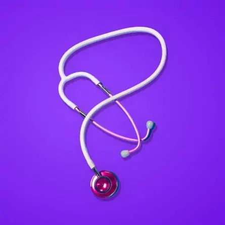 An image displaying a stethoscope resting on a vivid purple backdrop.