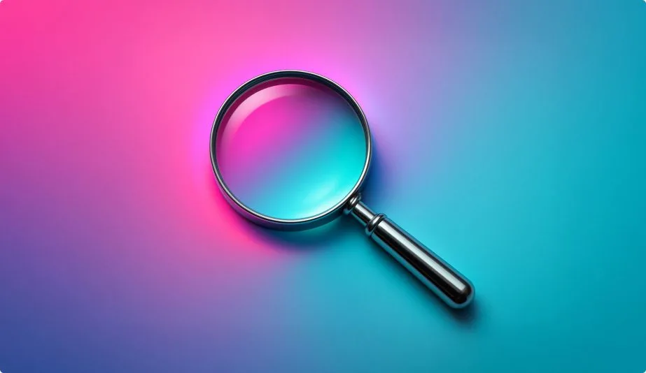 A metallic magnifying glass resting on a vivid gradient background of pink, purple, and teal light, symbolizing digital discovery and emerging trends.