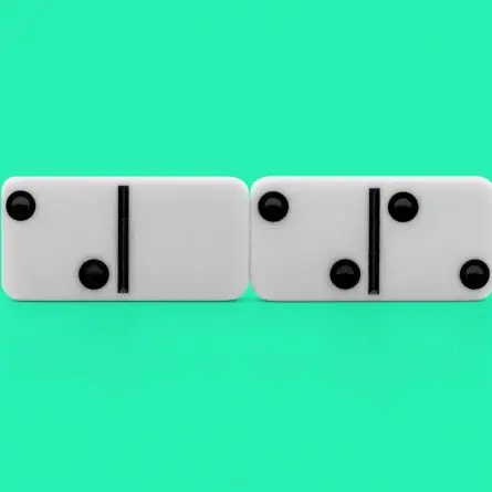 White domino tiles aligned side by side on a green background, representing strategic decision-making when selecting a web design agency for UX-driven website design and development.